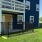 a blue building with a yard