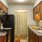 a kitchen with wood cabinets