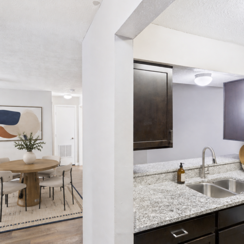 Staged apartment kitchen and dining area