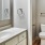 a bathroom with a sink toilet and mirror