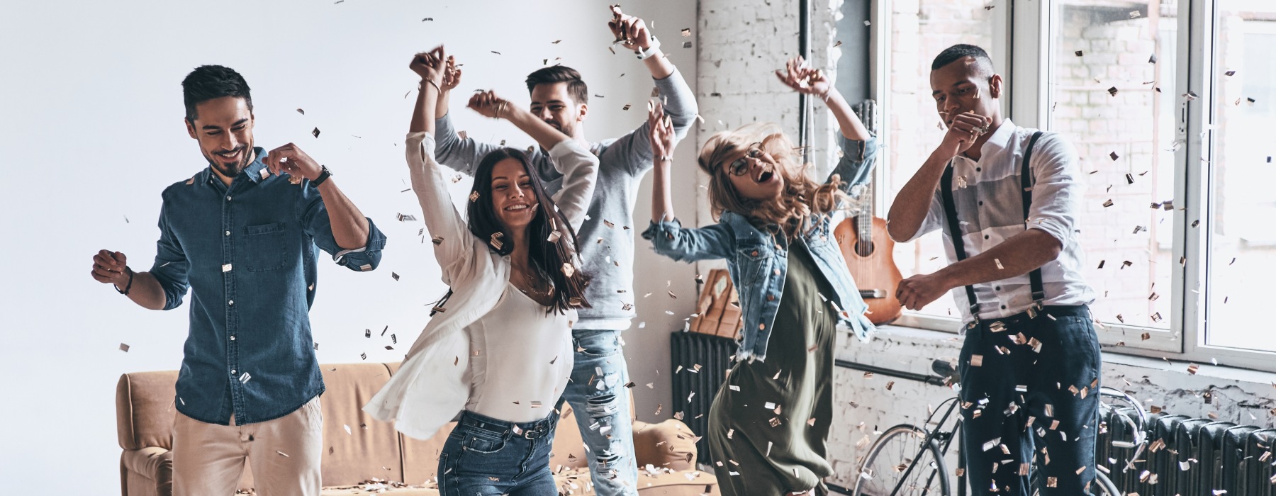 People dancing around in a room 